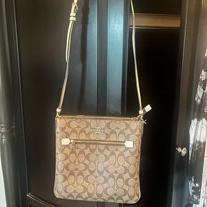 Tan Coach crossover bag in great condition.